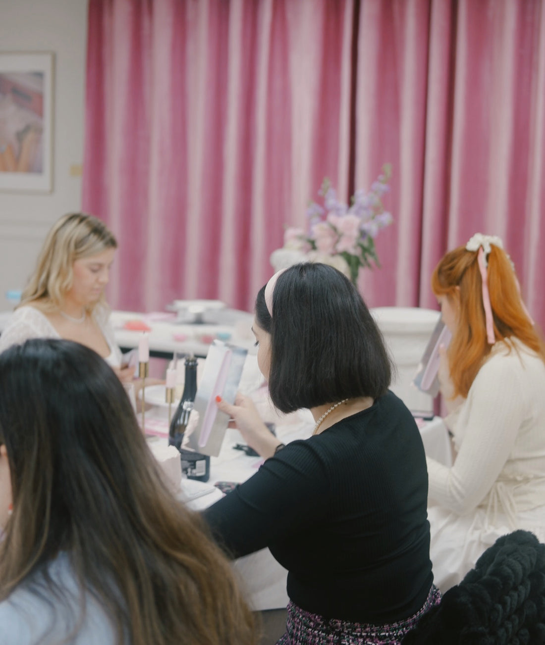 Girls decorating cakes at a cake decorating workshop in Sydney.